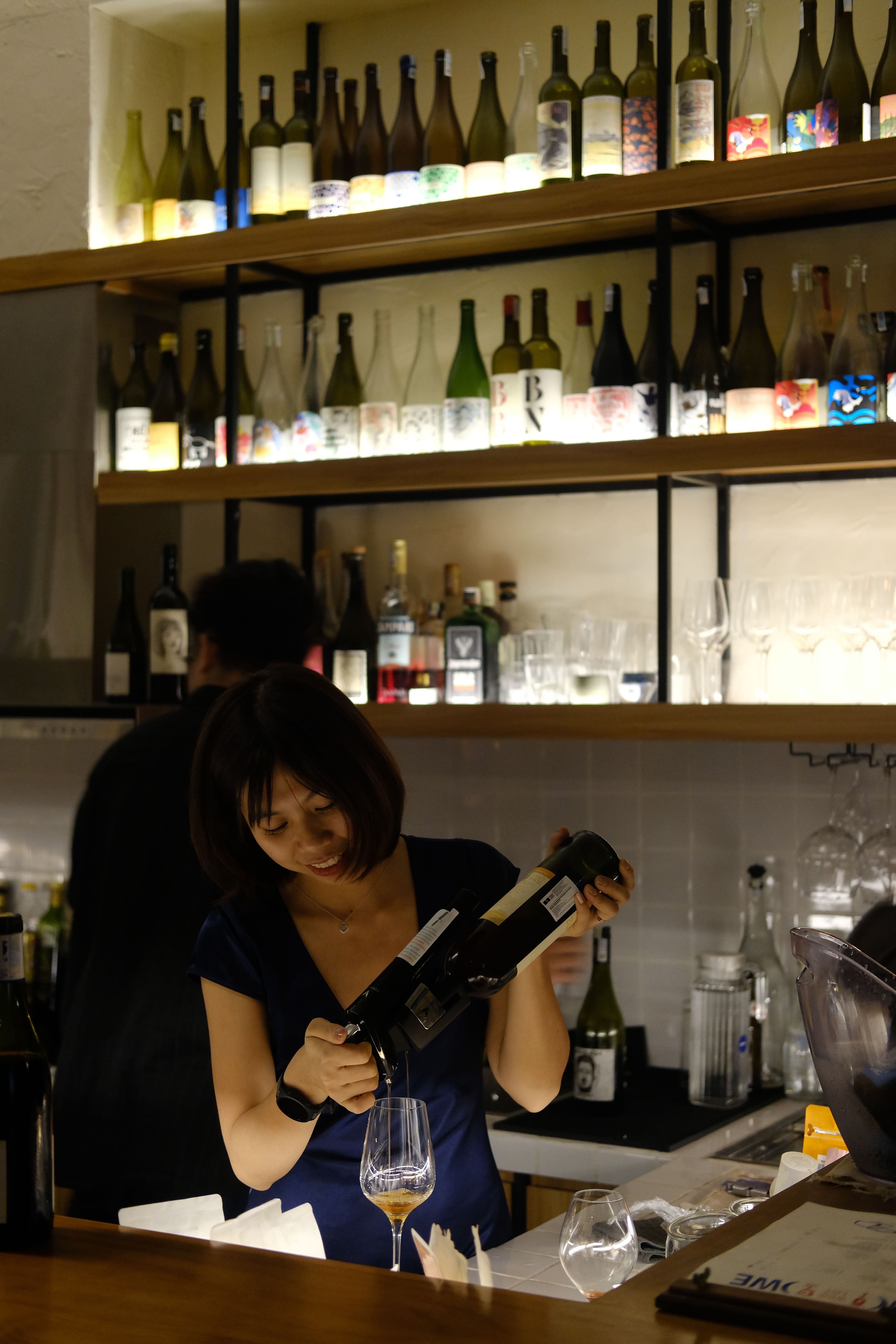 lady pouring wine