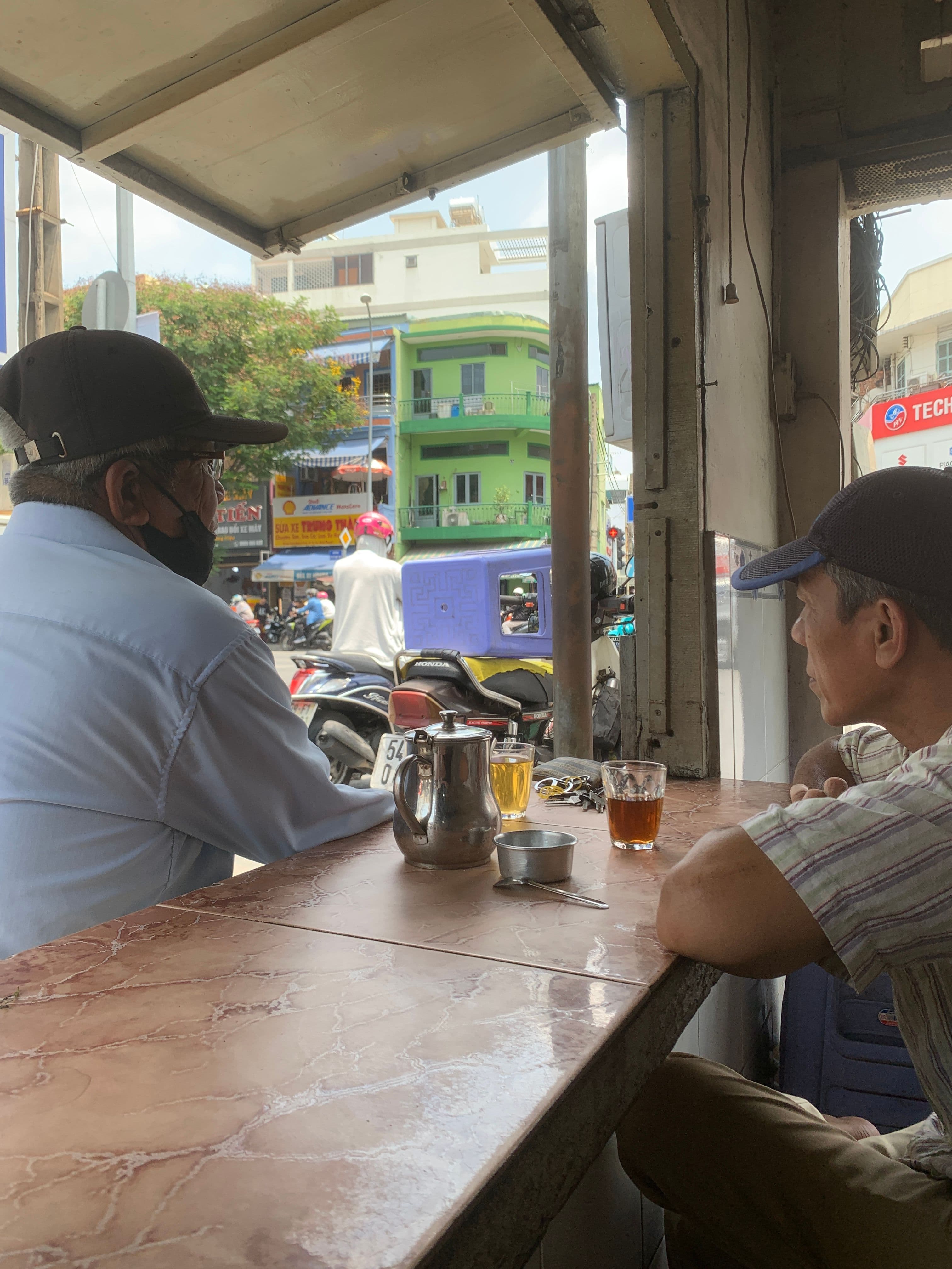 old guys drinking coffee cafe saigon