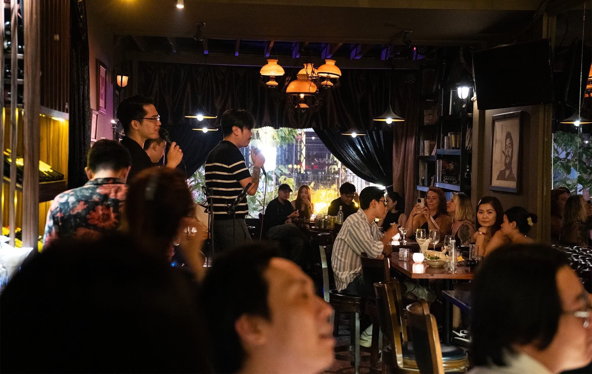 man singing bar saigon nighttime