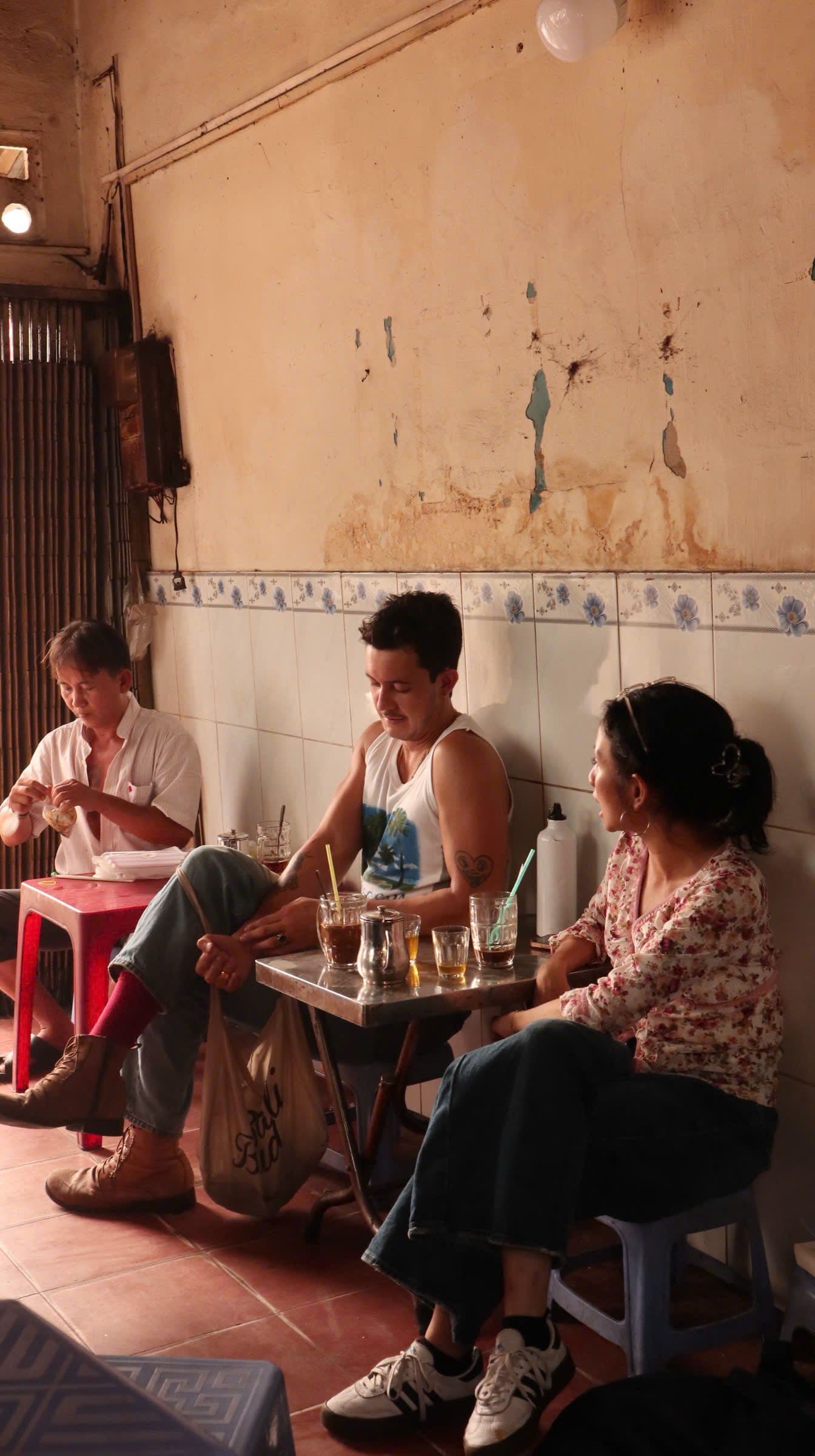 two people sitting in a cafe saigon vietnam