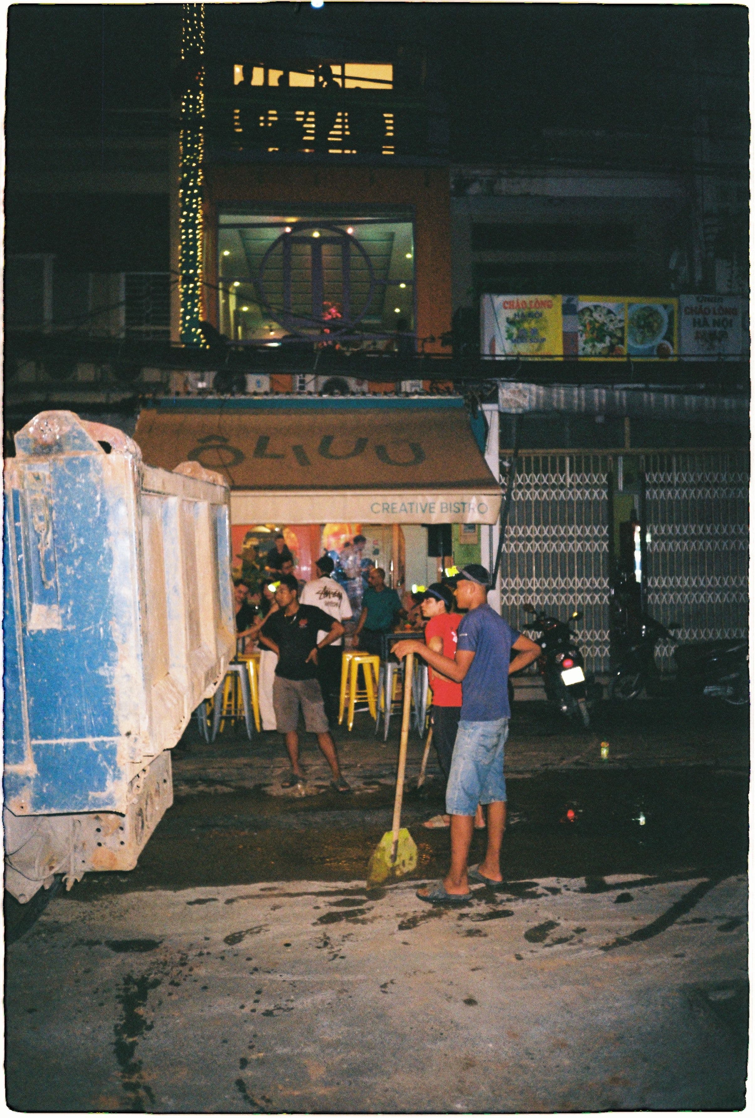 outside of oliuu restaurant with construction crew 